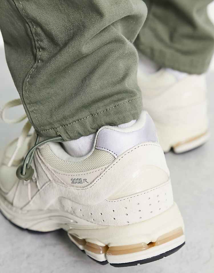 https://images.asos-media.com/products/new-balance-2002-trainers-in-off-white/202382010-4?$n_750w$&wid=750&fit=constrain